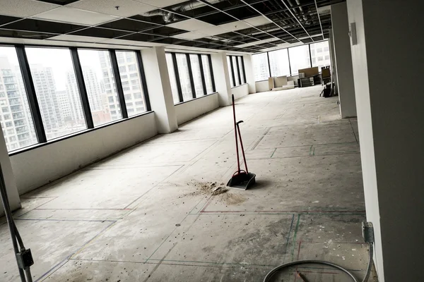 Office floor plate stripped to bare slab before a tenant improvement