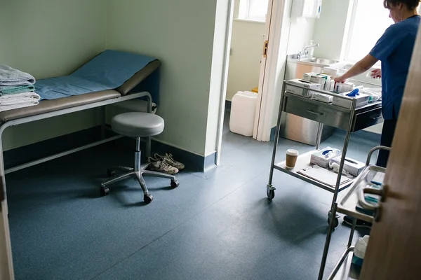 Non-porous healthcare rubber floor in a clinic with welded seams and coved junction