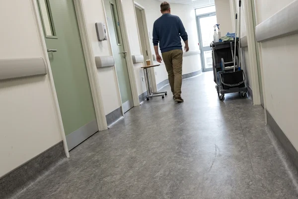 Clinic corridor after welded homogeneous sheet vinyl installation