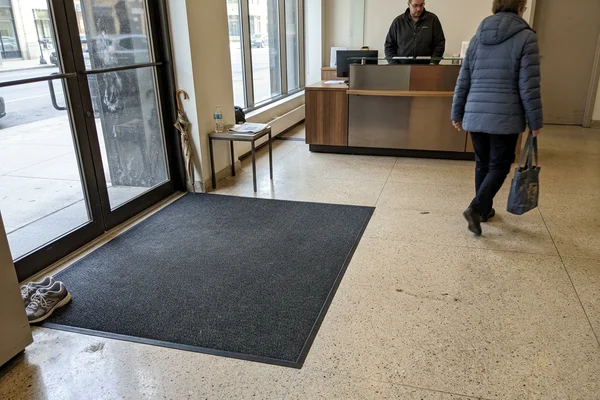 Lobby entrance after a recessed matting run installed flush with the finished floor