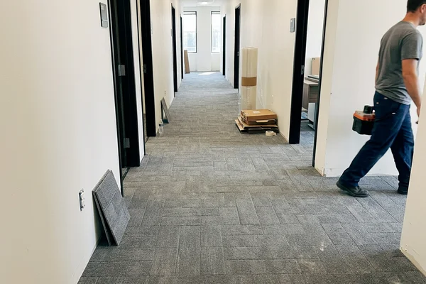 Office corridor finished with new modular carpet tile in an ashlar layout