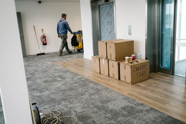 Finished office floor plate with carpet tile and LVT circulation bands