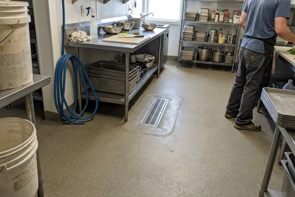 Urethane cement floor with integral cove in a commercial kitchen